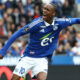 Soccer player in blue jersey.