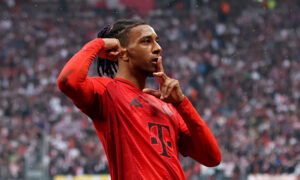 LEIPZIG, GERMANY - MAY 03: Michael Olise of Bayern Munich celebrates scoring his team's second goal during the Bundesliga match between RB Leipzig and FC Bayern München at Red Bull Arena on May 03, 2025 in Leipzig, Germany. (Photo by Maja Hitij/Getty Images)