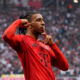 LEIPZIG, GERMANY - MAY 03: Michael Olise of Bayern Munich celebrates scoring his team's second goal during the Bundesliga match between RB Leipzig and FC Bayern München at Red Bull Arena on May 03, 2025 in Leipzig, Germany. (Photo by Maja Hitij/Getty Images)