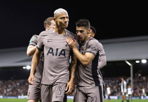 Spurs players celebrate goal.