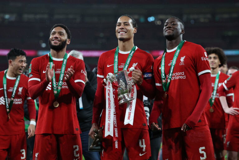 Liverpool players with trophy.