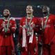 Liverpool players with trophy.