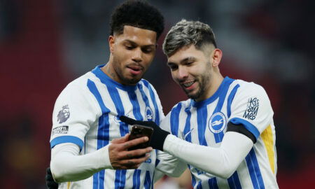 Brighton players celebrate goal.