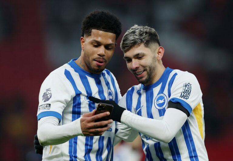 Brighton players celebrate goal.