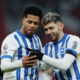 Brighton players celebrate goal.