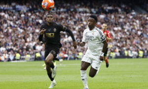 Real Madrid's Vinicius Junior in action with Valencia's Cristhian Mosquera. (REUTERS/Juan Medina)