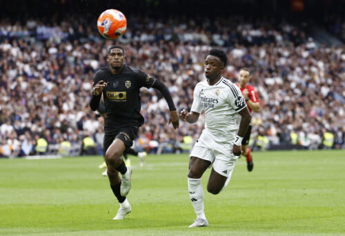 Real Madrid's Vinicius Junior in action with Valencia's Cristhian Mosquera. (REUTERS/Juan Medina)