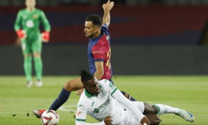 Barcelona's Eric Garcia in action with Getafe's Christantus Uche. (REUTERS/Albert Gea)