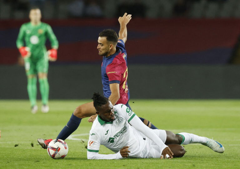 Barcelona's Eric Garcia in action with Getafe's Christantus Uche. (REUTERS/Albert Gea)