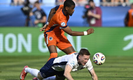 England's Elliot Anderson in action with Netherlands' Jorrel Hato. (REUTERS/Radovan Stoklasa)