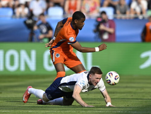 England's Elliot Anderson in action with Netherlands' Jorrel Hato. (REUTERS/Radovan Stoklasa)