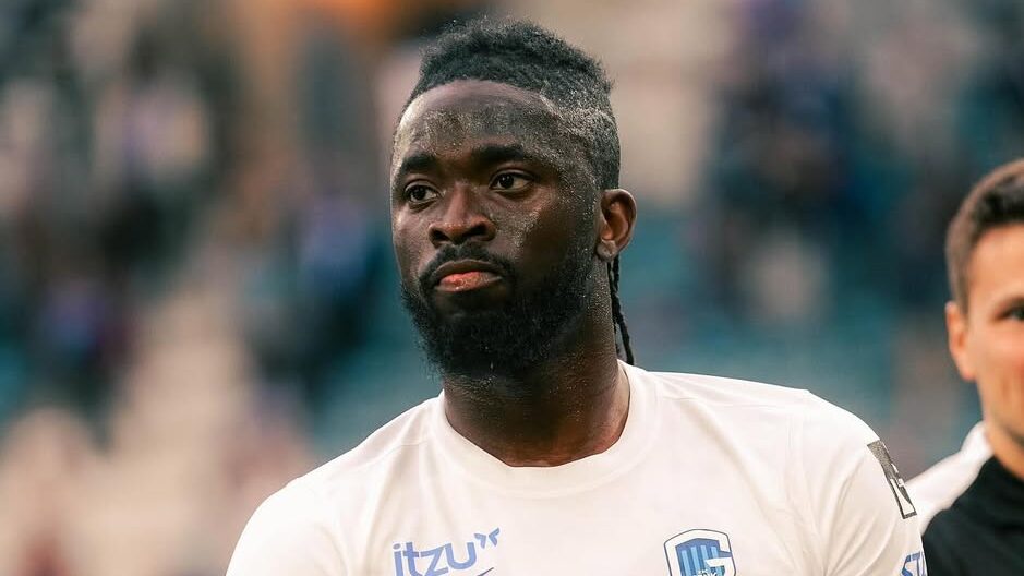 Soccer player in white.