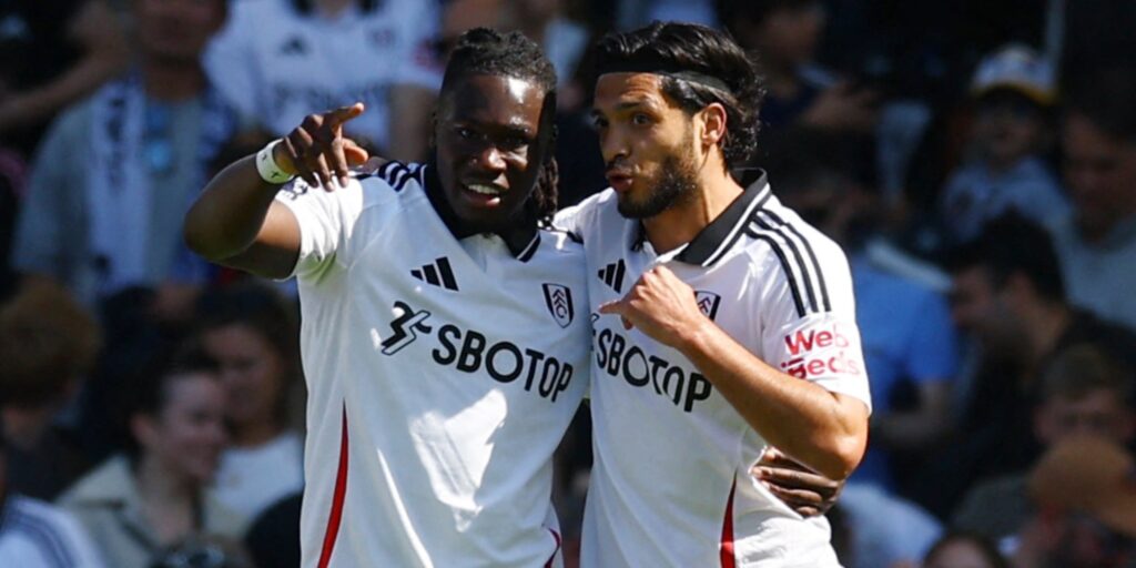 Fulham's Calvin Bassey and Raul Jimenez celebrate a goal in the Premier League.