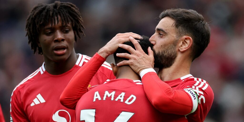 Manchester United's Patrick Dorgu, Amad Diallo and Bruno Fernandes celebrate a goal in the Premier League.