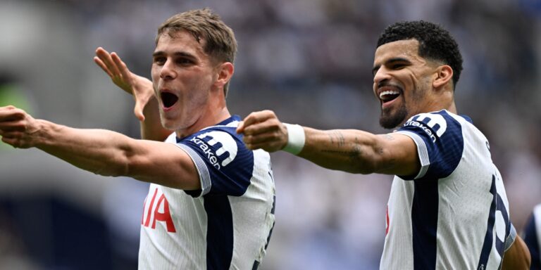 Tottenham Hotspur's Micky van de Ven and Dominic Solanke celebrate a goal in the Premier League.