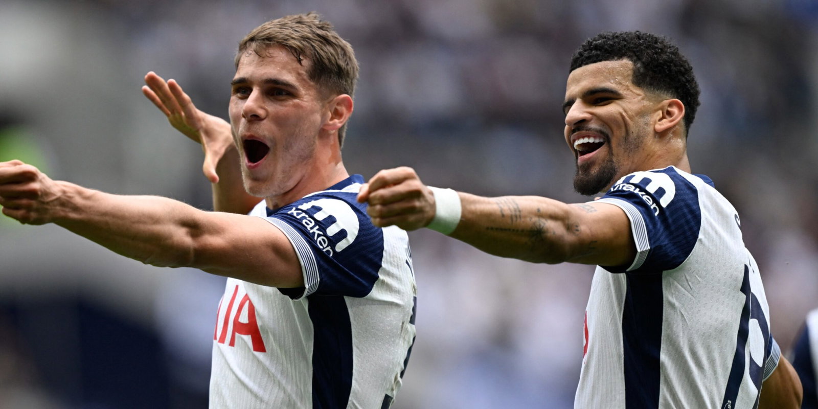 Tottenham Hotspur's Micky van de Ven and Dominic Solanke celebrate a goal in the Premier League.