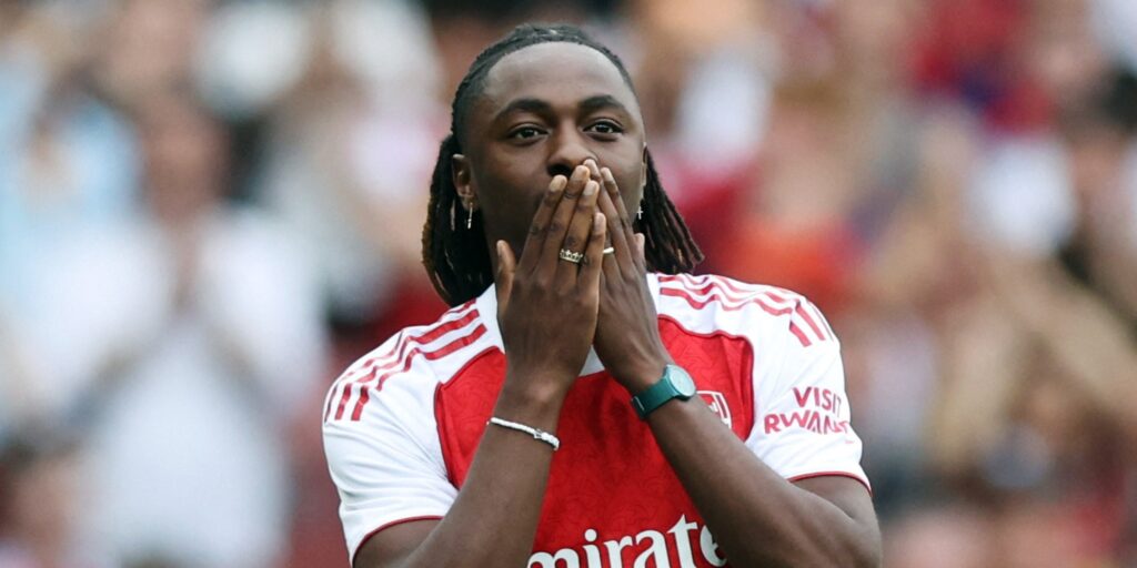 Ebere Eze greets the Arsenal fans at Emirates Stadium.