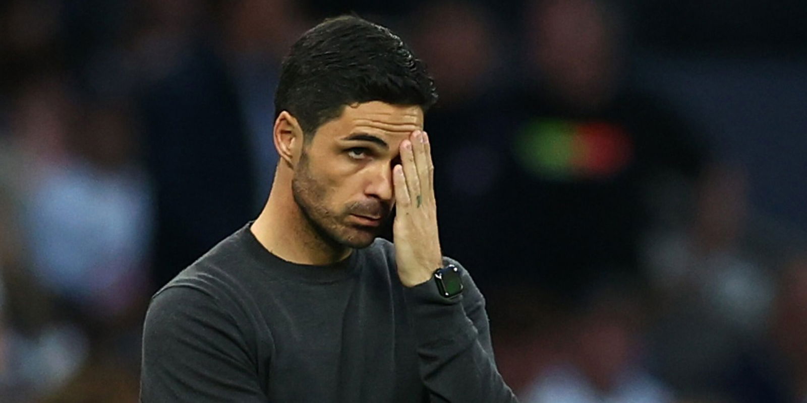 Arsenal manager Mikel Arteta looks dejected during a Premier League game.