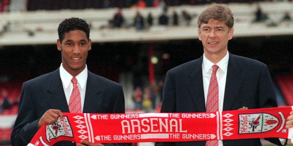 Nicolas Anelka poses with Arsene Wenger after signing for Arsenal.