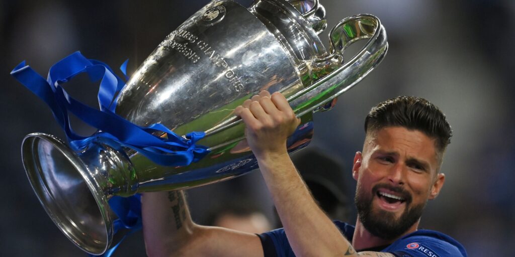 Chelsea striker Olivier Giroud celebrates with the Champions League trophy.