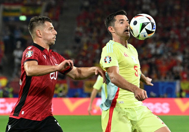 Spain's Daniel Vivian in action with Albania's Ylber Ramadani. (REUTERS/Carmen Jaspersen)