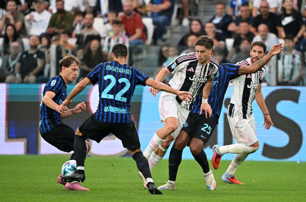 Juventus' Kenan Yildiz in action with Inter Milan's Henrikh Mkhitaryan and Nicolo Barella. (REUTERS/Alberto Lingria)