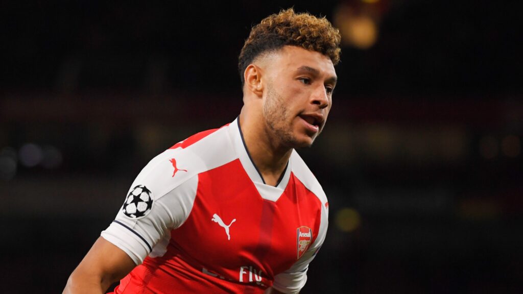 Arsenal midfielder Alex Oxlade-Chamberlain celebrates during a match.