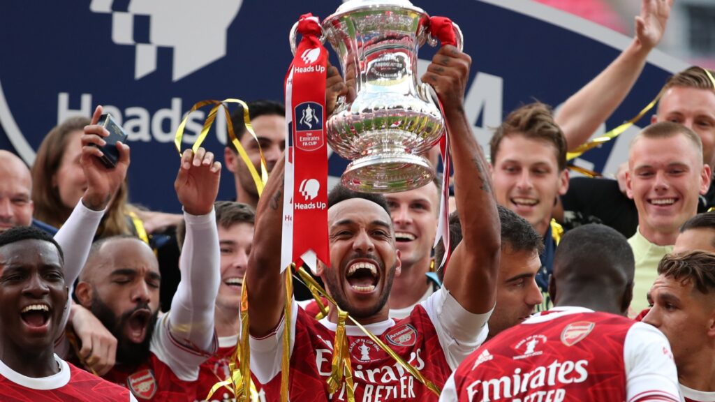 Pierre-Emerick Aubameyang lifting the FA Cup for Arsenal in 2020.