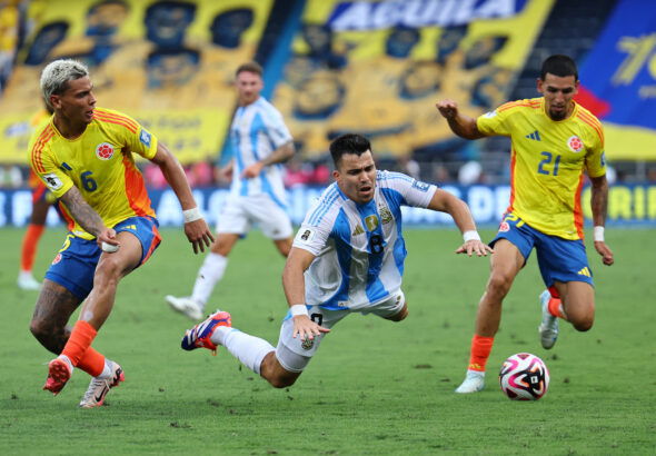 Argentina's Marcos Acuna in action with Colombia's Daniel Munoz. (REUTERS/Luisa Gonzalez)