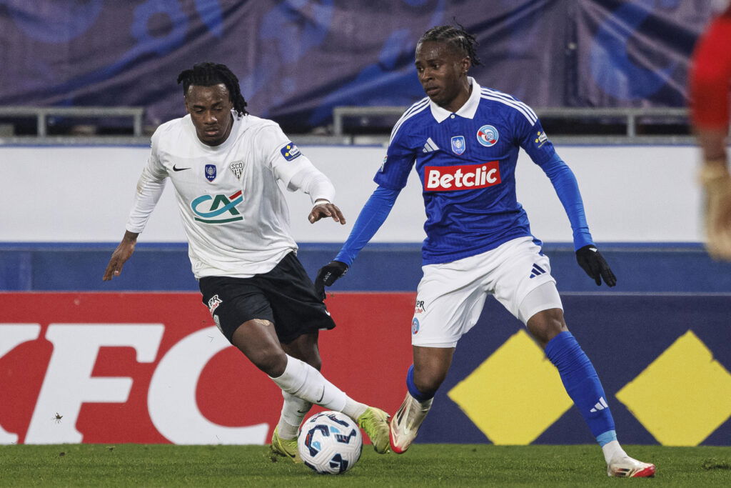 Lilian Raolisoa of Angers (L) is chased by Rayane Messi of Strasbourg (R). (Elyxandro Cegarra/Eurasia Sport Images/Getty Images)
