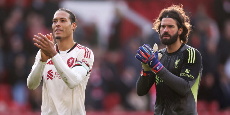 Virgil van Dijk and Alisson Becker. (Carl Recine/Getty Images)